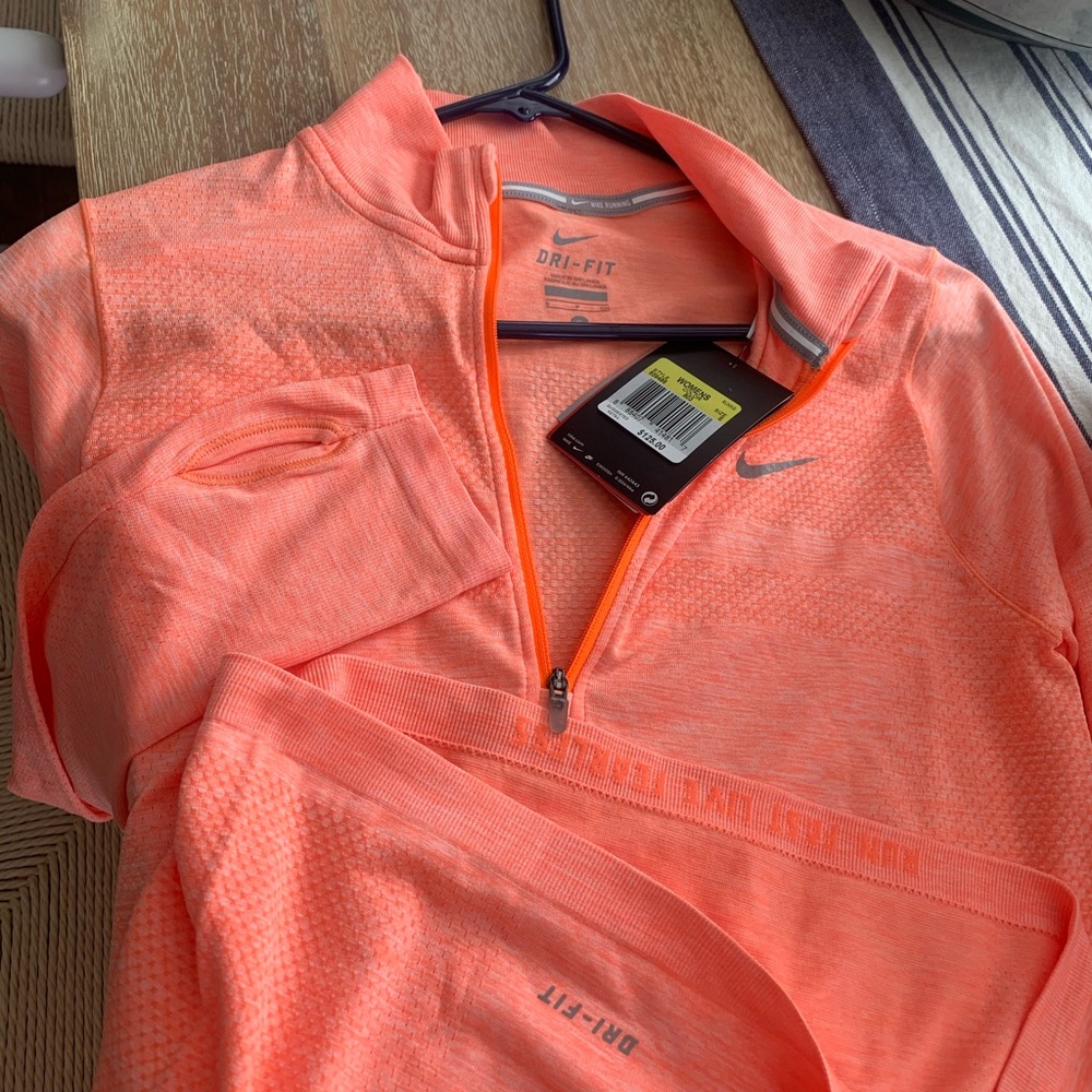Coral orange NWT running thumbholes zip Nike S